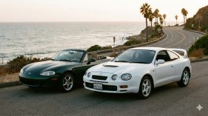 Une photographie argentique d'une Mazda MX-5 NB verte décapotable et d'une Toyota Celica GT-Four blanche garées côte à côte sur une route de bord de mer au coucher du soleil, avec l'océan et des palmiers en arrière-plan.